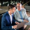 Business People Having Meeting In Modern Office In JHHWL8D 100x100
